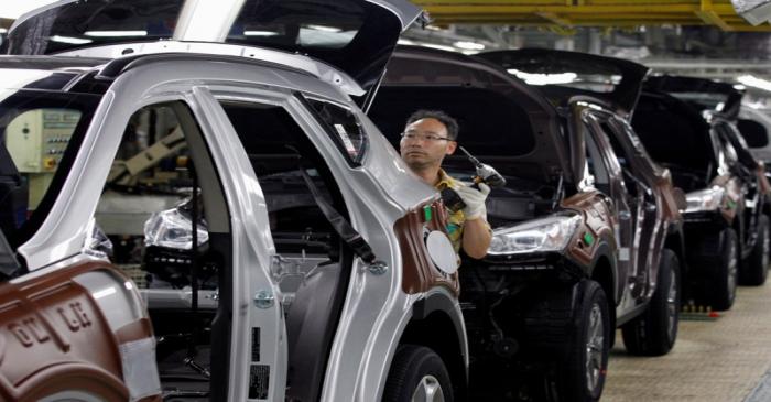 FILE PHOTO: A labourer works at the main factory of Hyundai Motor in Ulsan