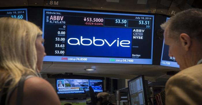 A screen displays the share price for pharmaceutical maker AbbVie on the floor of the New York