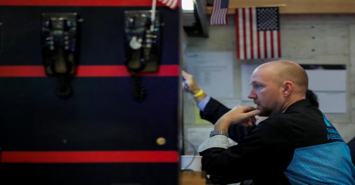 Traders work on the floor of the NYSE in New York