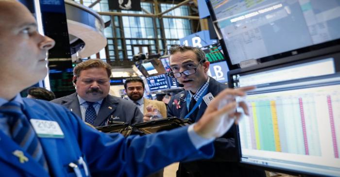 Traders work on the floor of the NYSE in New York