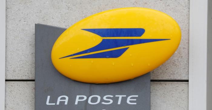 The logo of French postal service company La Poste is seen on a post office in Paris