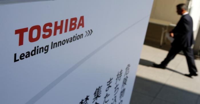 sThe logo of Toshiba is seen as a shareholder arrives at Toshiba's extraordinary shareholders