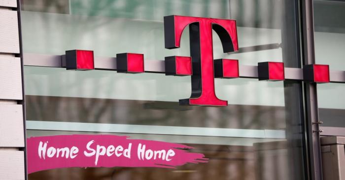 FILE PHOTO: The logo of German telecommunications giant Deutsche Telekom AG is seen at a