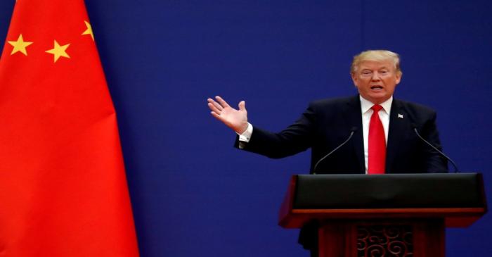 FILE PHOTO: FILE PHOTO: U.S. President Donald Trump delivers his speech as he and China's