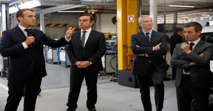 French President Emmanuel Macron and Carlos Ghosn, CEO of French car maker Renault, visit the