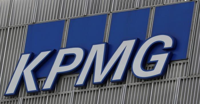 FILE PHOTO: The KPMG logo is seen at their offices at Canary Wharf financial district in London