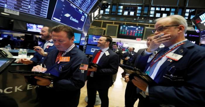 Traders work on the floor at the New York Stock Exchange (NYSE) in New York City