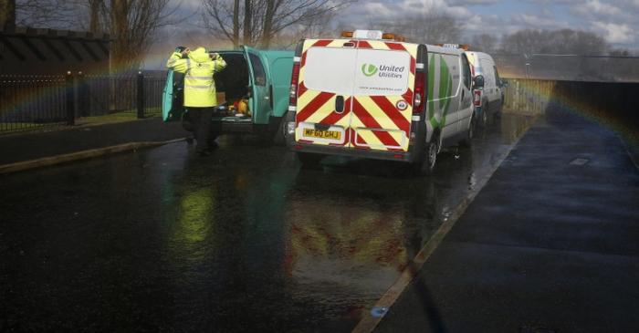 A United Utilities engineer arrives at the scene of a burst water main in Liverpool northern