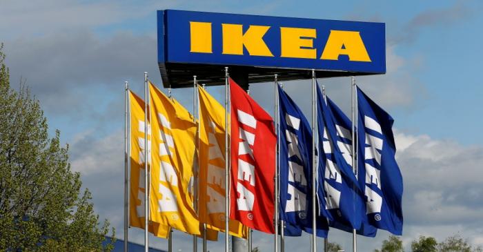 FILE PHOTO: Flags and the company's logo are seen outside of an IKEA Group store in