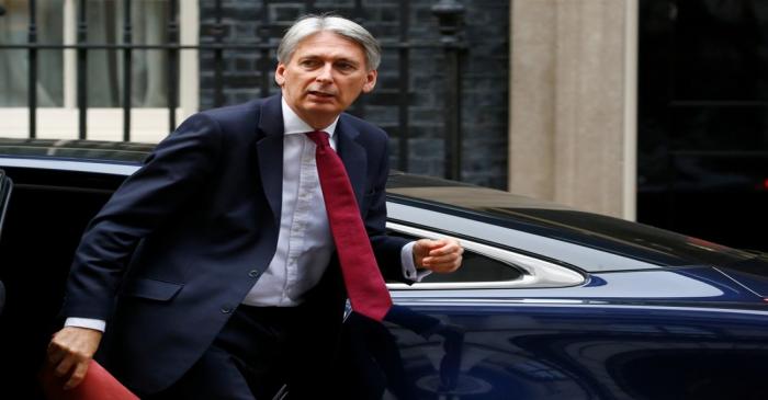 Britain's Chancellor of the Exchequer, Philip Hammond, arrives back at 11 Downing Street, in