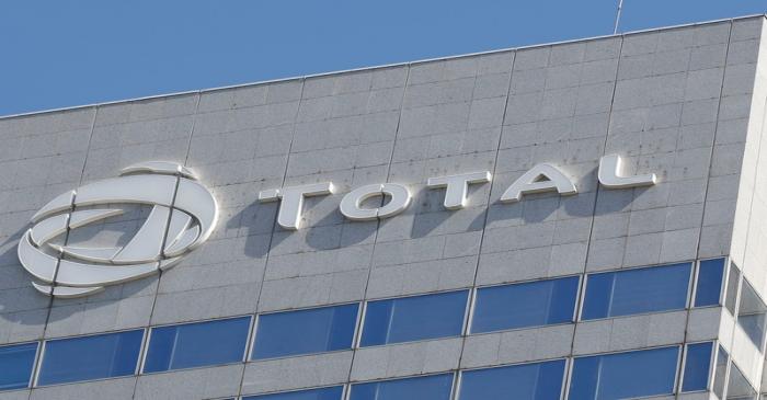 FILE PHOTO:  The logo of French oil giant Total is pictured on the facade of a building in