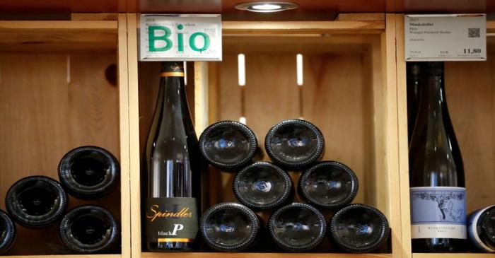 FILE PHOTO: Organic wines for sales are seen in a wine rack at Moevenpick Weinkeller wine shop