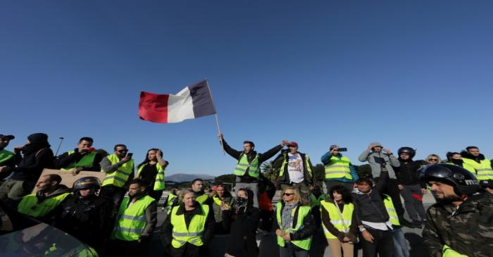 FILE PHOTO: People wearing yellow vests, a symbol of a French drivers' protest against higher