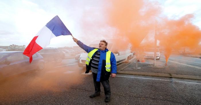 FILE PHOTO: A demonstrator wearing yellow vests, a symbol of a French drivers' protest against