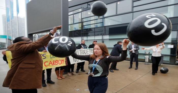 FILE PHOTO: Activists protest against carbon dioxide emissions in front of the U.N. Climate