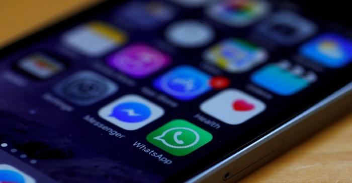 FILE PHOTO: WhatsApp and Facebook messenger icons are seen on an iPhone in Manchester ,