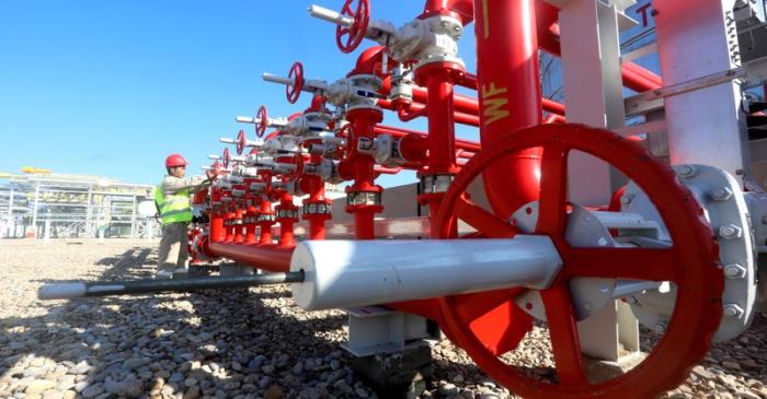 FILE PHOTO: Worker is seen at the new CPF3 oil station in the Halfaya oilfield in southern of