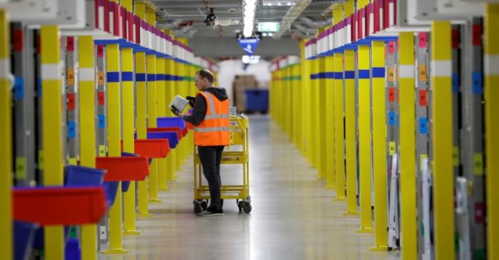 An employee works at the Amazon fulfillment center in the village of Dobroviz, near Prague