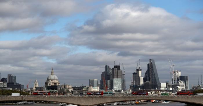 Buildings in the City of London are seen behind Waterloo Bridge in London