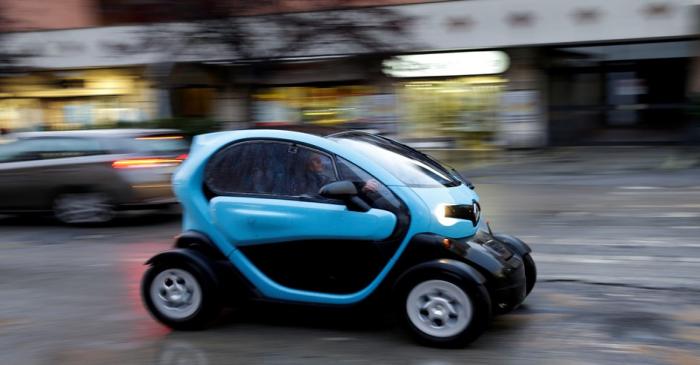 FILE PHOTO: A woman drives a Renault Twizy two-seat electric car in Rome