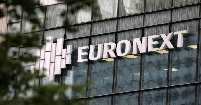 The logo of stock market operator Euronext is seen on a building in the financial district of