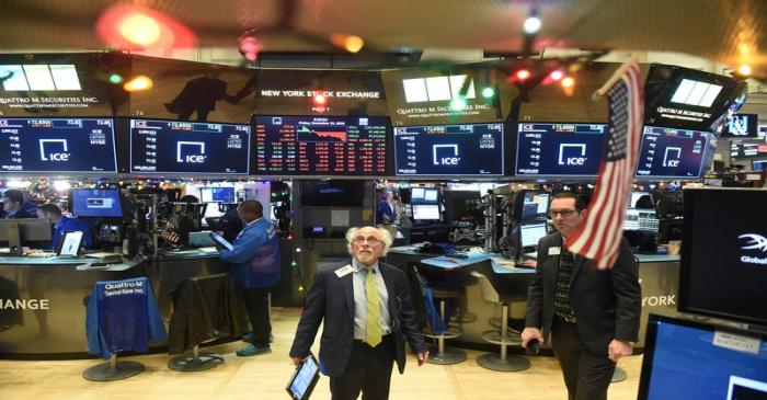 Traders work on the floor of the NYSE in New York