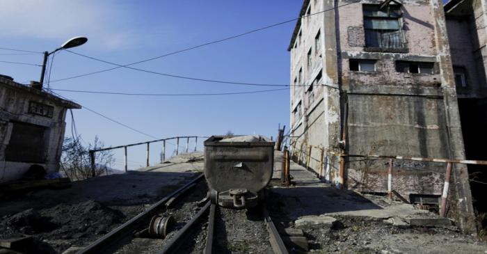 A transporter is seen outside a closed exit of Zhengyang coal mine on the outskirts of Jixi in