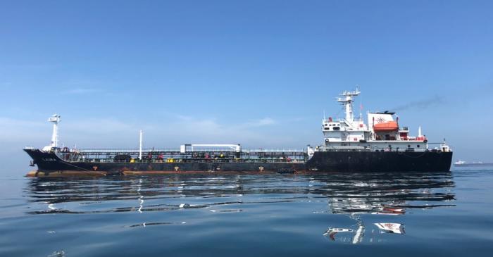 An oil tanker is seen in the sea outside the Puerto La Cruz oil refinery in Puerto La Cruz