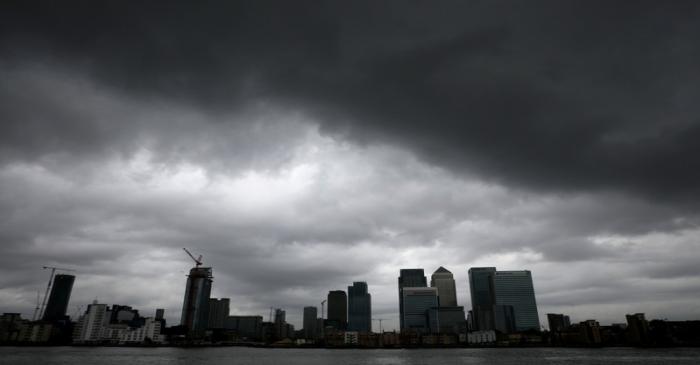 Rain clouds pass over Canary Wharf financial financial district in London