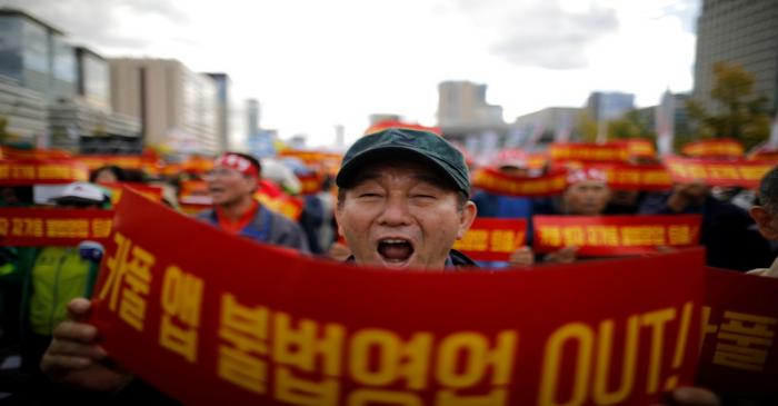 FILE PHOTO: A taxi driver takes part in a protest against a carpool service application, in