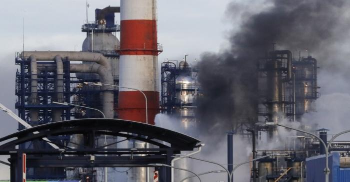 Smoke billows from a fire at oil refinery, owned by Russian oil producer Gazprom Neft, in