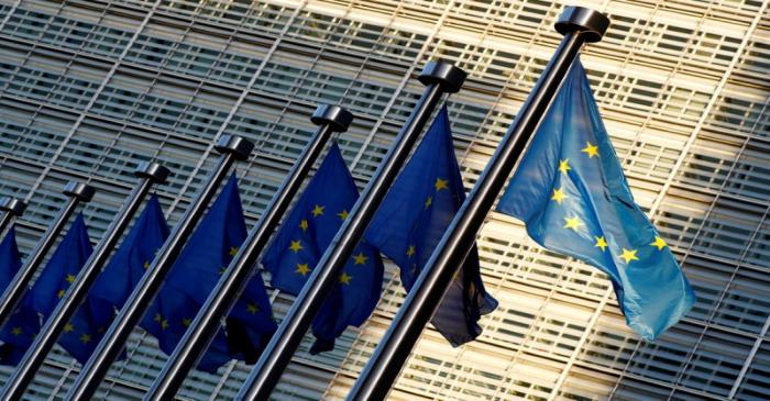 FILE PHOTO: EU flags outside the EU Commission headquarters in Brussels