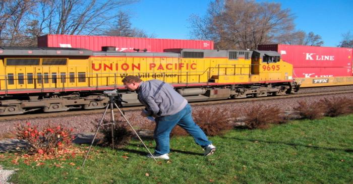 FILE PHOTO: Wayne Davis films a passing Union Pacific train in Rochelle Illinois