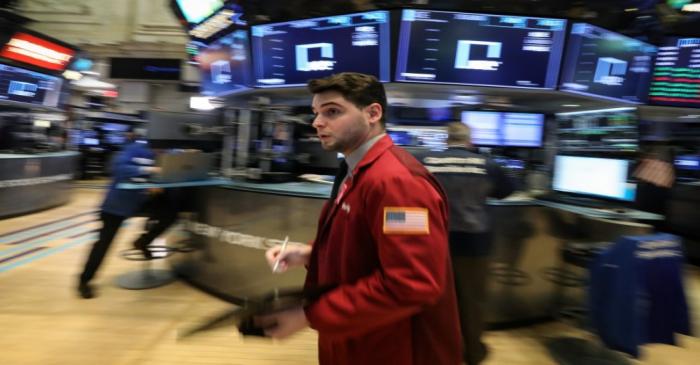 Traders work on the floor of the NYSE in New York