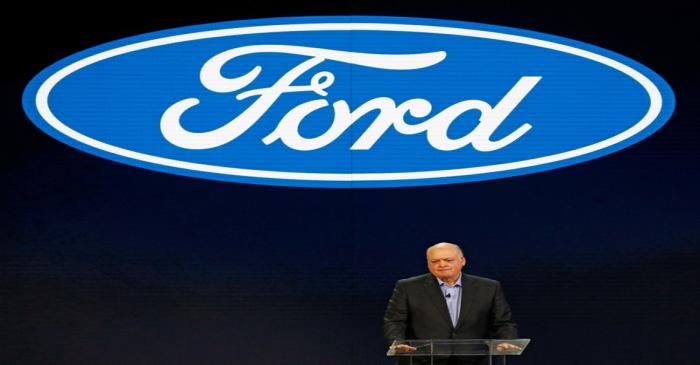 FILE PHOTO: Jim Hackett (L), President and CEO of Ford Motor Company, speaks at the Ford press