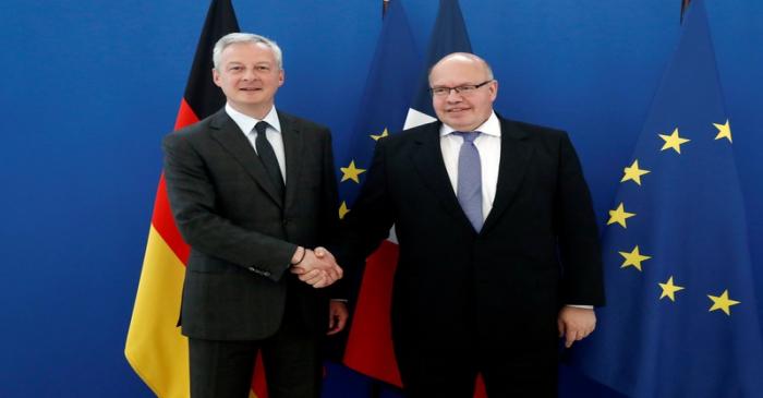 French Economy and Finance Minister Bruno Le Maire shakes the hand of German Minister of