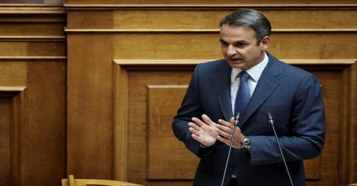 Greek PM Mitsotakis addresses lawmakers during a parliamentary session in Athens