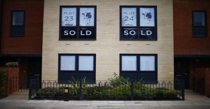 Sold new build homes are seen on a development in south London