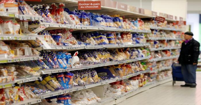 FILE PHOTO - A man looks at children's snacks displayed on shelves as he shops at a Carrefour