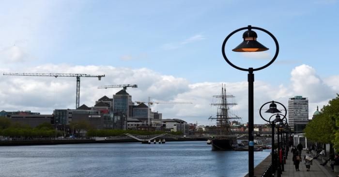 Construction cranes are seen in the Irish Financial Services Centre in Dublin