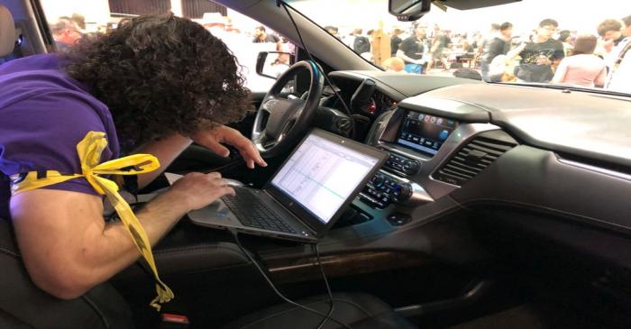 An attendee of the 2019 DEF CON cybersecurity event is seen at the conference's car hacking