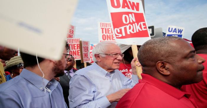 FILE PHOTO: Democratic U.S. presidential candidate Senator Bernie Sanders carries a Strike sign