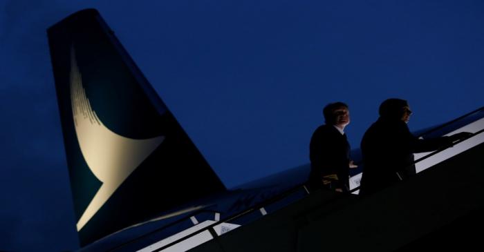 Pilots walk up to a new Cathay Pacific Airways Airbus A350 after being received by the airline