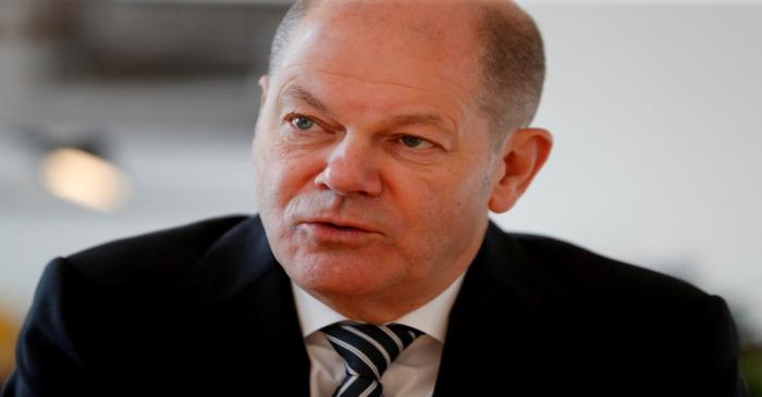 German Finance Minister Olaf Scholz is pictured in his office during an interview with Reuters