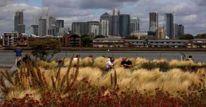 The Canary Wharf financial district stands beyond the Greenwich Maritime Museum in London