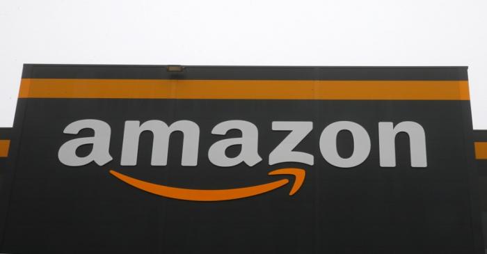 FILE PHOTO: The Amazon logo is seen at the Amazon fulfilment center in Bretigny-sur-Orge near