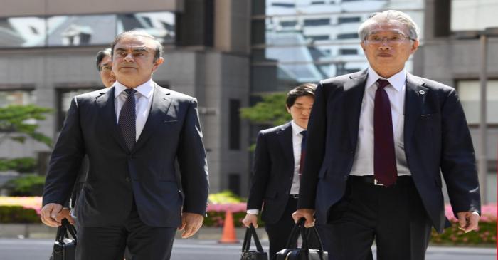 Former Nissan Motor Co. Chairman Carlos Ghosn and his lawyer Junichiro Hironaka arrive at the