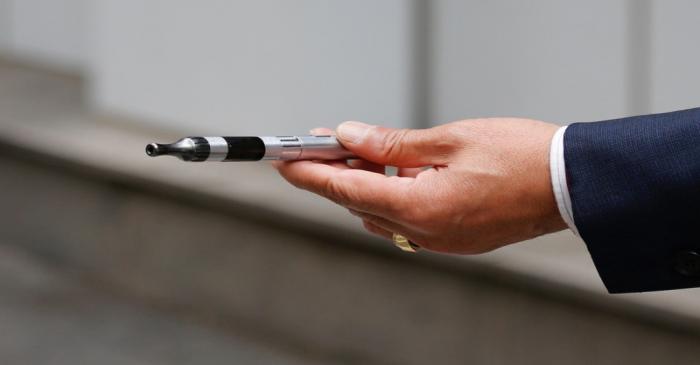 A man uses a vape device in Seoul