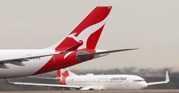 FILE PHOTO: Qantas planes taxi at Kingsford Smith International Airport in Sydney, Australia