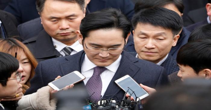 Samsung Group chief, Jay Y. Lee, leaves after attending a court hearing to review a detention